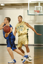 Men's Basketball Outlasts Lasell, 115-107